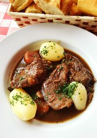 Close-up of beef curry with potatoes in plate