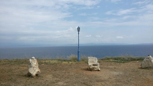 Scenic view of sea against cloudy sky