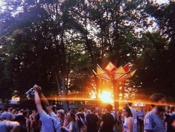 People enjoying music concert at night