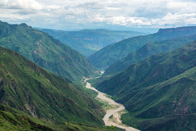 Scenic view of mountains against cloudy sky at chicamocha canyon