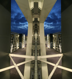 Low angle view of modern building against cloudy sky
