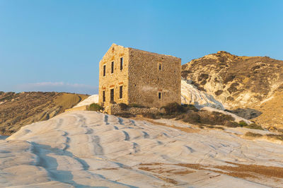 Low angle view of building against blue sky