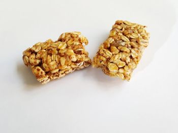 High angle view of bread in plate against white background