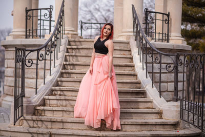 Portrait of young woman on staircase