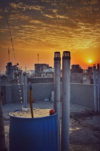 Cityscape against sky at sunset