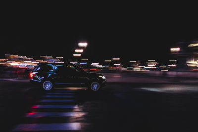 Vehicles on road at night