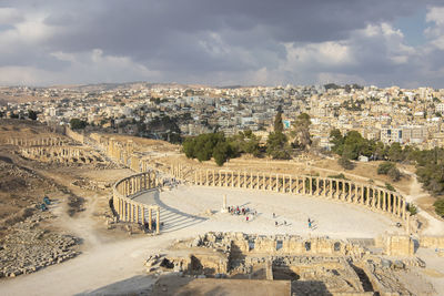 High angle view of  the roman city of jerash, jordan, against cloudy sky