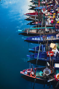 Boats moored at harbor