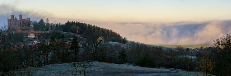 Panoramic view of city during winter against sky