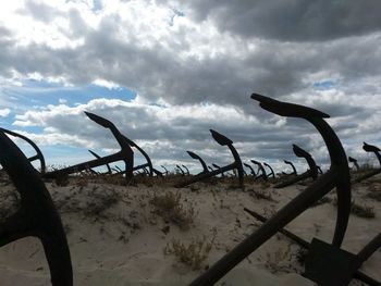 Scenic view of calm sea against cloudy sky