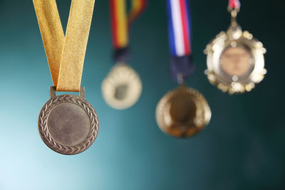 Close-up of medals against blackboard