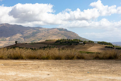 Scenic view of landscape and mountains against sky