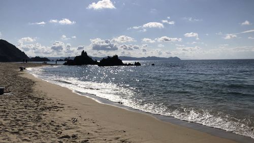 Scenic view of beach against sky