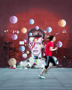 Full length of young woman in mid-air