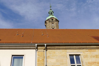 Low angle view of bell tower against sky