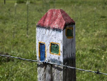 Close-up of old wooden fence on field