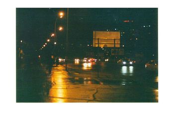 Illuminated city street at night