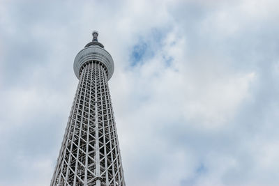 Low angle view of building against cloudy sky