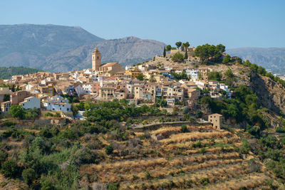 Polop old town, church and castle, surrounded by terraced fields, alicante, costa blanca, spain