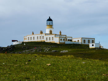 View of building against cloudy sky