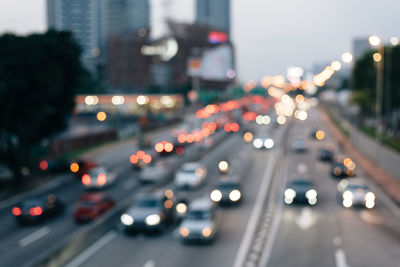 Defocused image of traffic on city street at night
