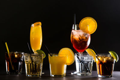 Close-up of beer glass against black background