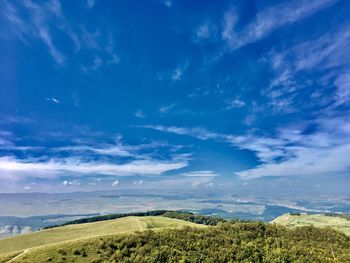 Scenic view of sea against blue sky