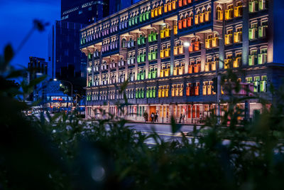 Illuminated buildings in city at night