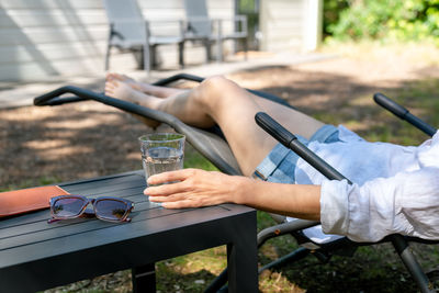 Midsection of woman using mobile phone