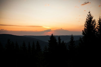 Scenic view of silhouette mountains against sky at sunset