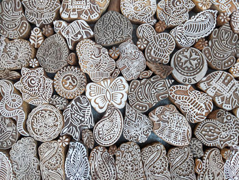 Full frame shot of rubber stamps representing symbols of indian culture