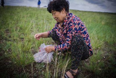 Side view of woman on field