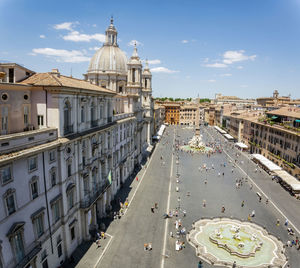 Top view of piazza navona in rome with a crowd of unrecognizable tourists on a sunny day. 