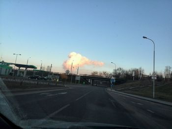 Cars on road against sky