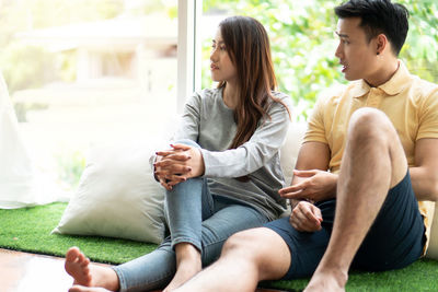 Young couple sitting on sofa