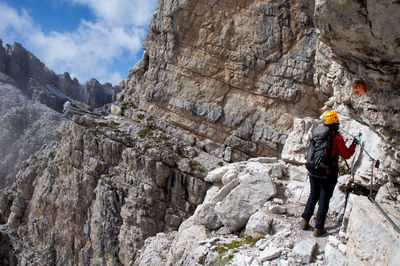 Rear view of woman mountain climbing