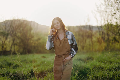 Young woman standing on field