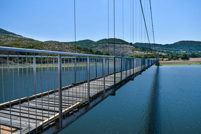 Bridge over river against sky