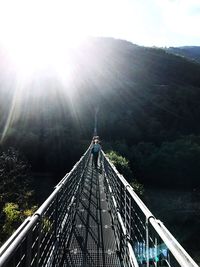 Low angle view of footbridge against clear sky