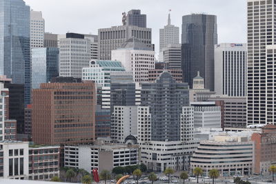 Buildings in city against sky