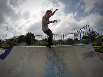 Full length of man inline skating on skateboarding ramp
