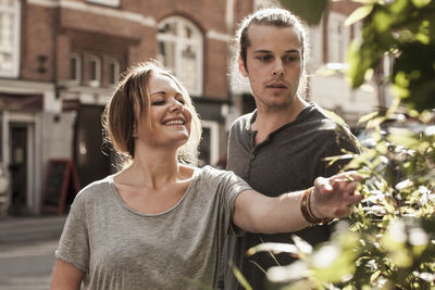 Couple looking at plants outdoors