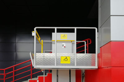 Close-up of yellow sign on wall