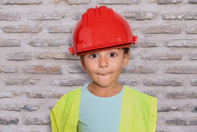 Portrait of boy against wall