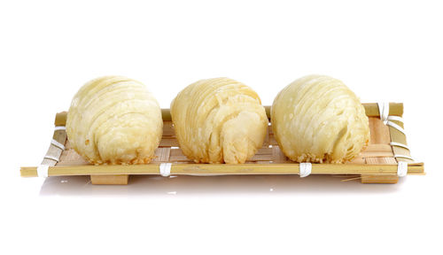 Close-up of cake against white background