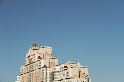 Low angle view of building against blue sky