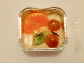 High angle view of fruits in plate on table