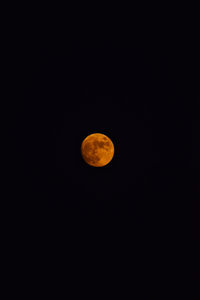 Low angle view of moon against sky at night