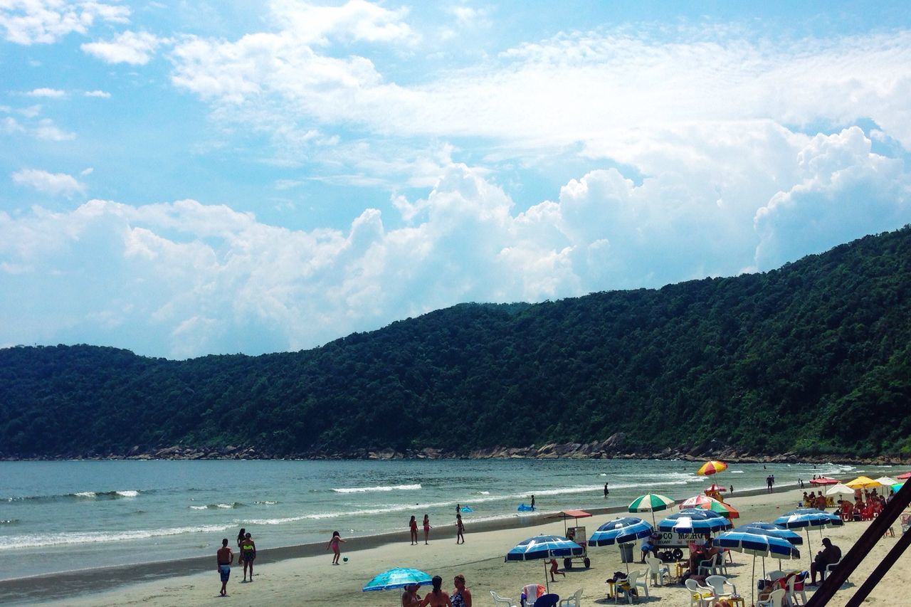 mountain, large group of people, beach, sky, lifestyles, leisure activity, water, mountain range, vacations, sea, scenics, cloud - sky, men, person, tourist, beauty in nature, nature, shore, tourism