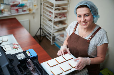 Portrait of chef working at kitchen